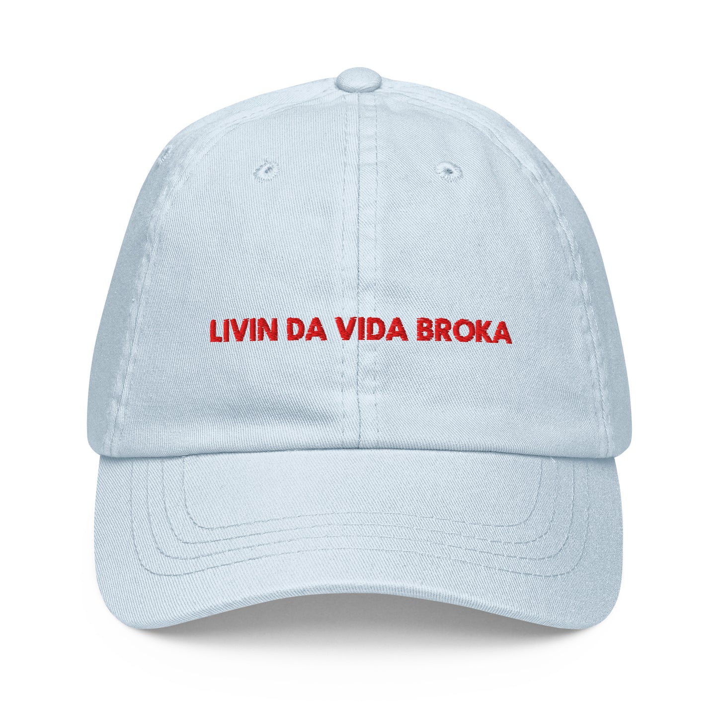 Pastel Blue embroidered baseball cap, front view (embroidery mockup currently reads "LIVIN DA VIDA BROKA" — misspelling, pending corrected artwork)