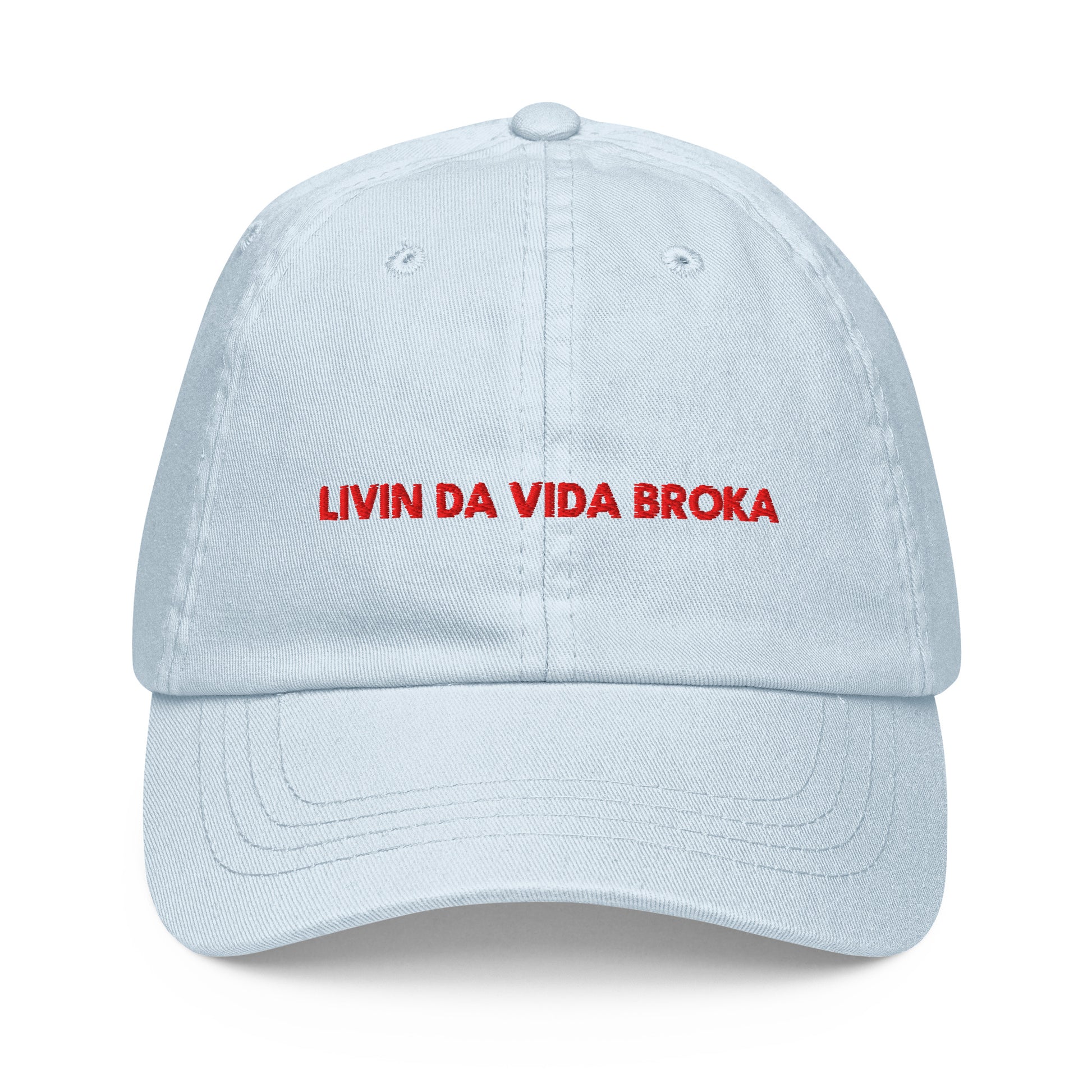Pastel Blue embroidered baseball cap, front view (embroidery mockup currently reads "LIVIN DA VIDA BROKA" — misspelling, pending corrected artwork)